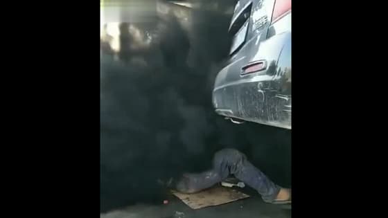 The car put a big black fart!Man repair car encounter funny accident