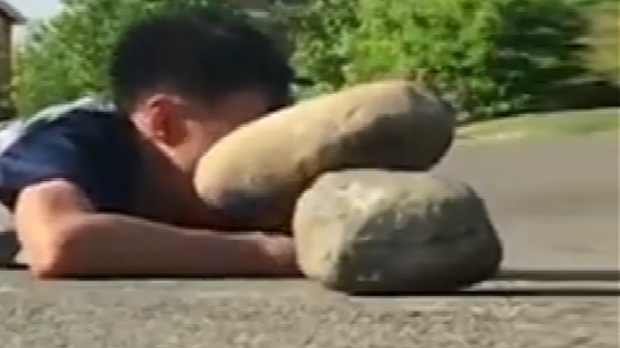 The moment of being struck by stones, the little brother who is sad.