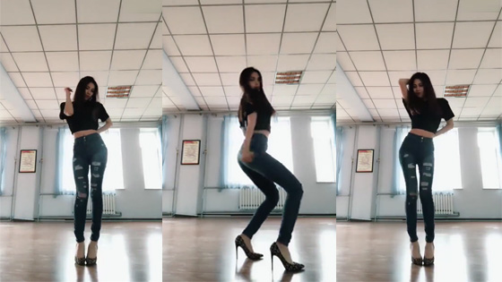 The Beautiful girl was dancing in the danceroom alone.