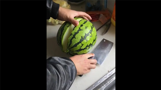 The man was ready to eat the watermelon. When he cut the watermelon, he and his wife were shocked.