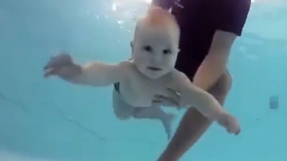 The baby is a master swimmers and can turn over in the water.
