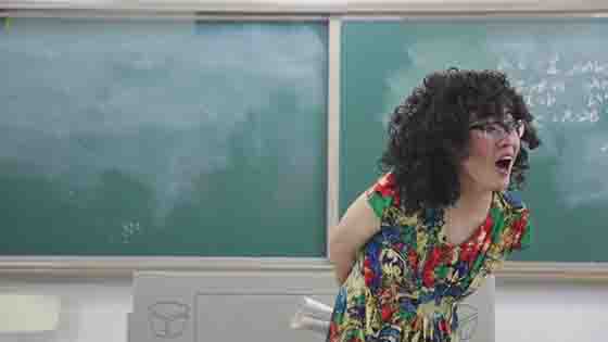 The blogger who dresses up as a woman is playing the role of a college math teacher this time!
