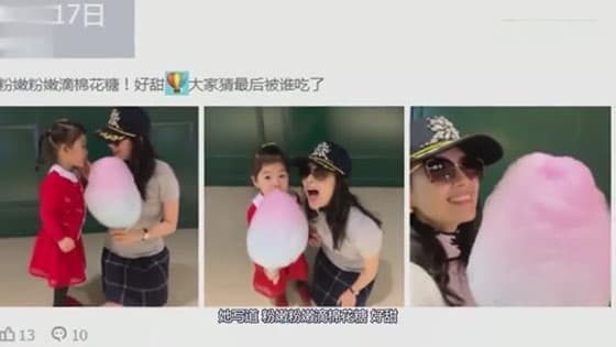 Zhang ziyi knelt and wiped her daughter's mouth,her eyes full of spoiling