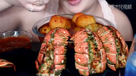Professional eating fried lobster tail potatoes and seafood boiled, simply too appetizing