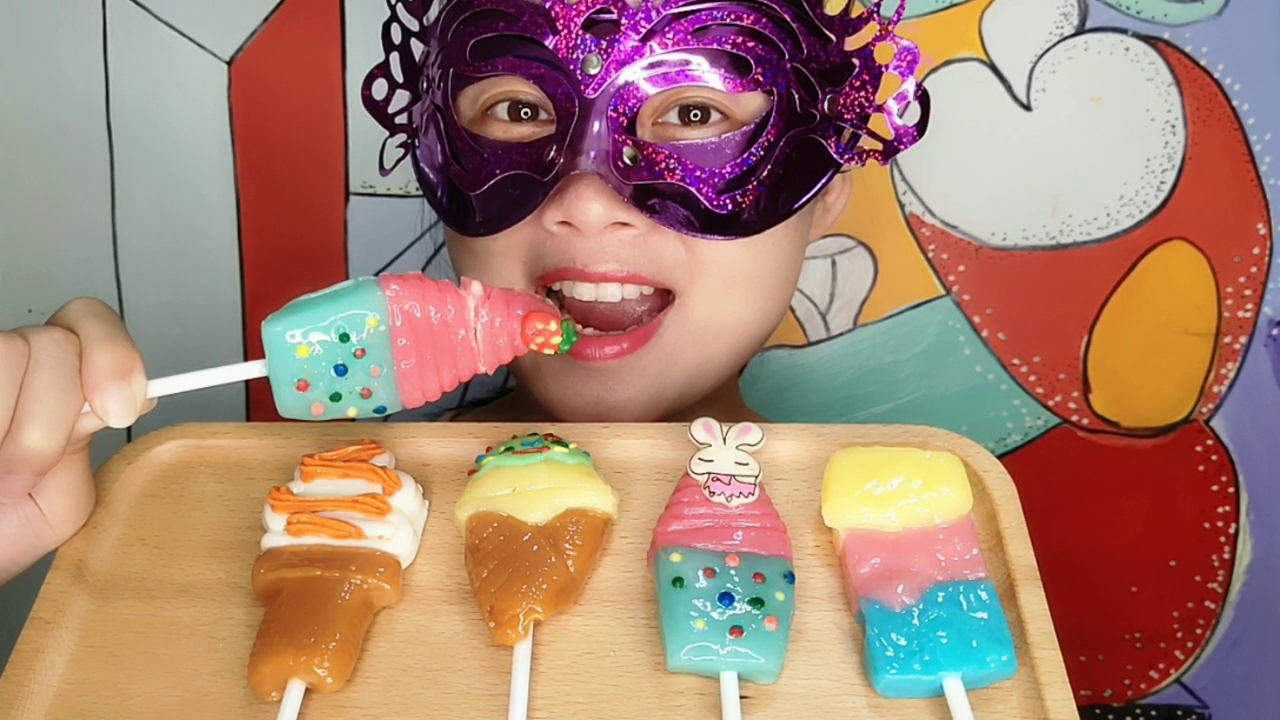 The lady eats "ice-cream lollipops" with high creative appearance and good taste in various colors.