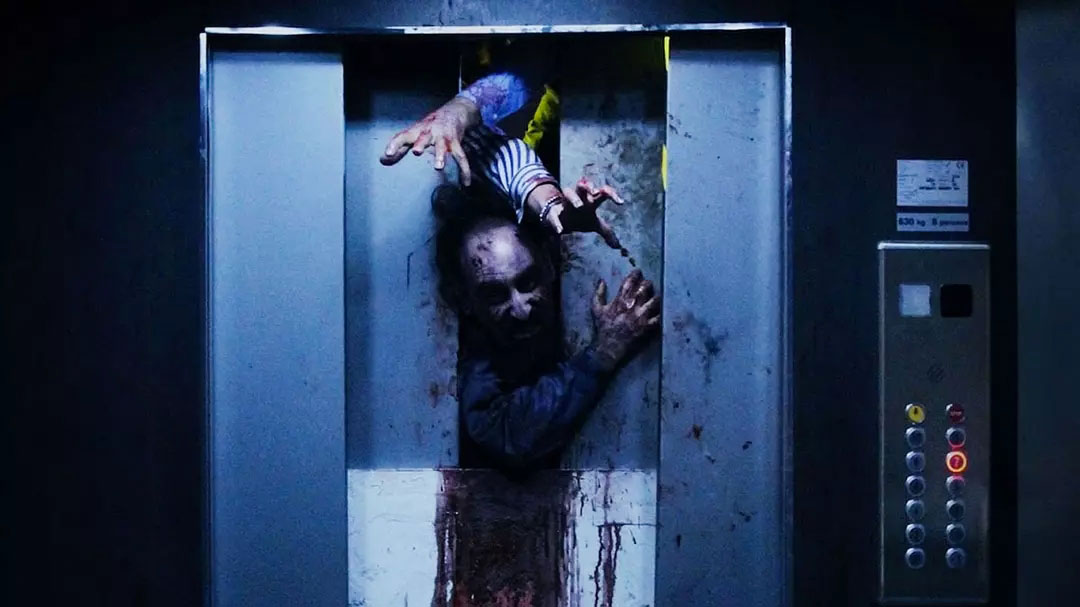 The man was locked in a broken elevator and opened again with a group of zombies coming!