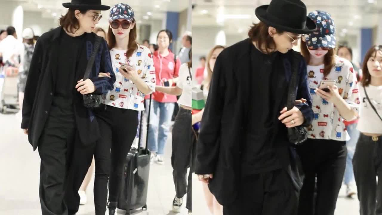 Qi Wei's Girls'Dress and Li Chenghyun appeared at the airport, walking hand in hand, bowing their heads and honeying their love.