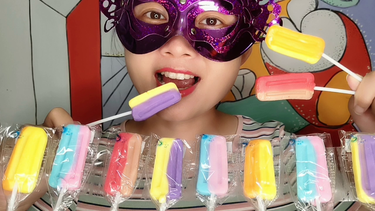 Miss and sister eat interesting candy "colorful popsicle lollipop", colorful sweet and delicious