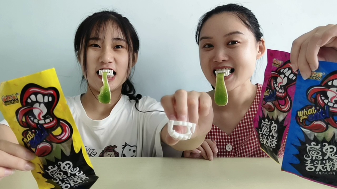They eat "Devil's Tongue Sugar" and play dress with green tongue. Q-play is sour, sweet and delicious.