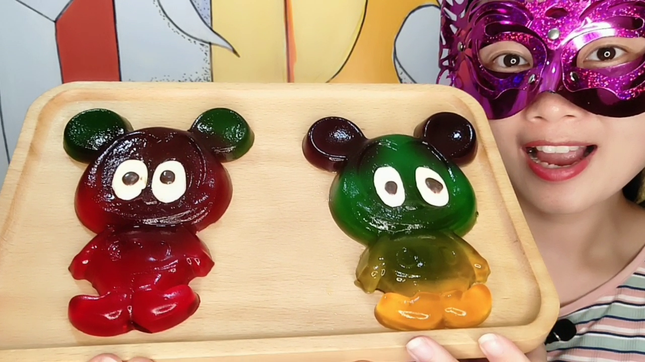 The lady eats Mickey Mouse Jelly. It's vivid and interesting. She tastes delicious and refreshing.