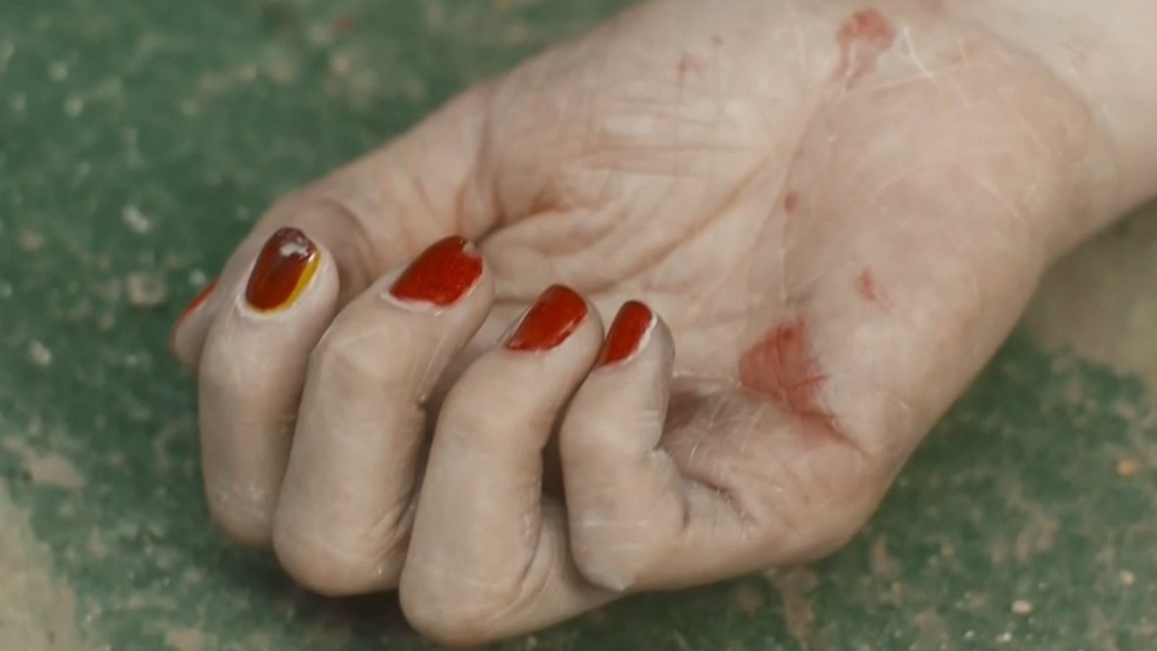 The murderer specializes in young women and paints the victim red nails every time.