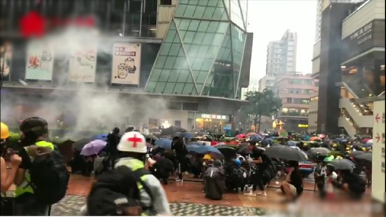 Hong Kong protester threw homemade burning bottles at the police