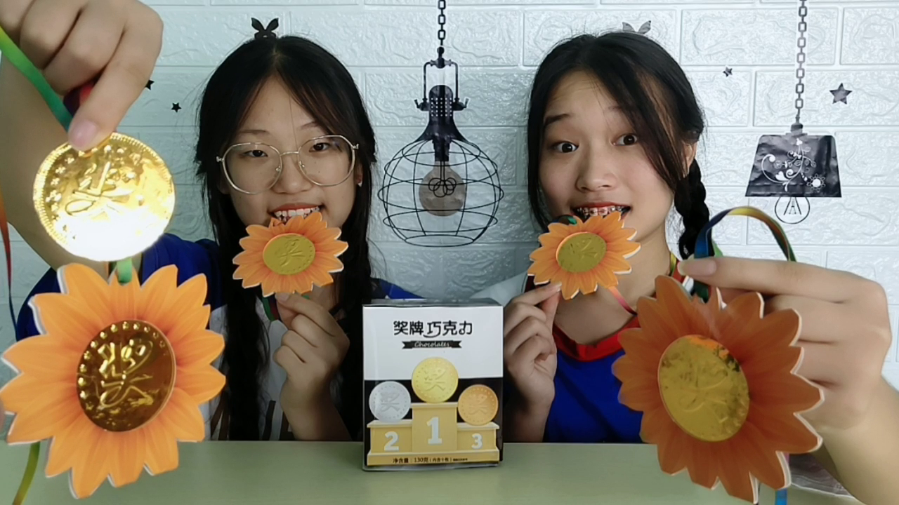 Two girls won "medals" by breaking their wrists. They sparkled gold and ate it. Creative chocolate was delicious and funny.