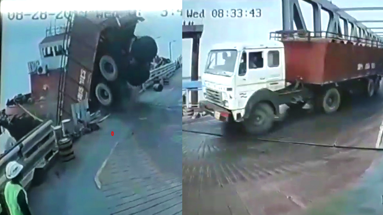 The truck brakes failed to break through the guardrail and crash into the sea. The wharf workers calmly watched the whole journey.