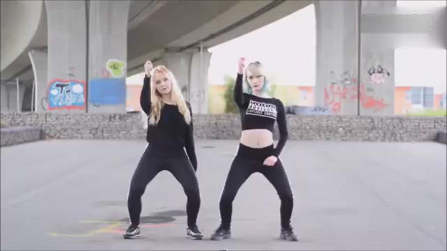 Two girls sexy dancing under the bridge