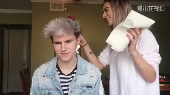 Funny. Beauty sprays her boyfriend's hair blue and blue. The next scene of boyfriend's expression is too funny.