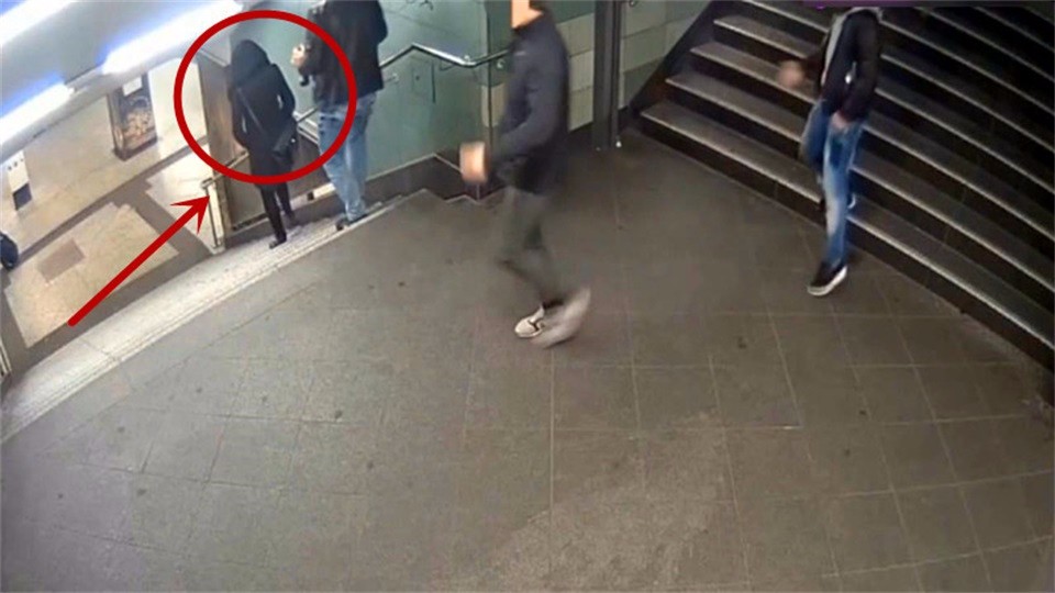 The man kicked the woman down the stairs with one foot. If it wasn't for surveillance, who would believe it?